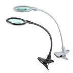 Lampe à pince LED Lumeno 680X avec col de cygne flexible, en noir et blanc, idéale pour les travaux de précision.