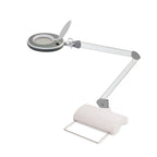 Lampada Lumeno 821X in grigio su base da tavolo bianca con braccio orientabile